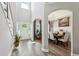 Elegant foyer featuring hardwood floors, high ceilings, and an adjacent dining area at 2624 Chase Rdg, Kennesaw, GA 30144