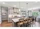 Modern kitchen with an island, stainless steel appliances, and hardwood flooring at 2624 Chase Rdg, Kennesaw, GA 30144