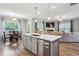 An open concept living area with kitchen island, dining table and living room at 2624 Chase Rdg, Kennesaw, GA 30144