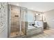 A luxurious main bathroom with a walk-in shower, soaking tub, and modern fixtures at 2624 Chase Rdg, Kennesaw, GA 30144