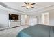 A spacious main bedroom with a tray ceiling, soft carpet, and ample closet space at 2624 Chase Rdg, Kennesaw, GA 30144
