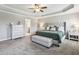 A serene main bedroom with a tray ceiling, soft carpet, and a calming color scheme at 2624 Chase Rdg, Kennesaw, GA 30144