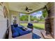 Outdoor covered patio features outdoor furniture, a stone fireplace, and a view of the backyard at 2624 Chase Rdg, Kennesaw, GA 30144