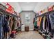 Spacious walk-in closet with organized shelving, hanging racks, and natural light from window at 2624 Chase Rdg, Kennesaw, GA 30144