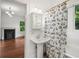 Charming bathroom with a pedestal sink and a decorative shower curtain at 1095 Saint Charles Ne Pl, Atlanta, GA 30306