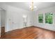 Light-filled bedroom boasts hardwood floors and an ensuite bathroom at 1095 Saint Charles Ne Pl, Atlanta, GA 30306