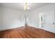 Bedroom featuring hardwood floors and access to additional rooms at 1095 Saint Charles Ne Pl, Atlanta, GA 30306