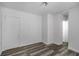 This bedroom features freshly painted walls and dark hardwood flooring at 1095 Saint Charles Ne Pl, Atlanta, GA 30306