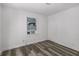 A bright bedroom showcases the gray wood-look flooring and fresh white walls at 1095 Saint Charles Ne Pl, Atlanta, GA 30306