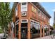 Red brick building exterior featuring 'Dark Horse Tavern' sign with a vintage-inspired aesthetic at 1095 Saint Charles Ne Pl, Atlanta, GA 30306