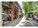 Unique business exterior with colorful doors, neon signs, and outdoor seating, creating a lively atmosphere at 1095 Saint Charles Ne Pl, Atlanta, GA 30306