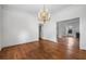 Dining room boasts hardwood floors, elegant lighting, and seamless transition to living spaces at 1095 Saint Charles Ne Pl, Atlanta, GA 30306