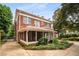 A beautiful brick home with a screened in porch and lush landscaping at 1095 Saint Charles Ne Pl, Atlanta, GA 30306