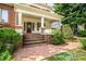 Beautiful brick steps lead to the front door, framed by lush landscaping and charming planter boxes at 1095 Saint Charles Ne Pl, Atlanta, GA 30306