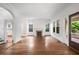 Bright and airy living room boasts hardwood floors, a fireplace, and views of the front porch at 1095 Saint Charles Ne Pl, Atlanta, GA 30306