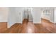 Bright and airy living room with hardwood floors, white walls, and arched doorways at 1095 Saint Charles Ne Pl, Atlanta, GA 30306