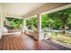 Inviting front porch with brick flooring, classic columns, and a relaxing porch swing at 1095 Saint Charles Ne Pl, Atlanta, GA 30306