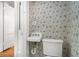 Classic powder room featuring patterned wallpaper at 1095 Saint Charles Ne Pl, Atlanta, GA 30306