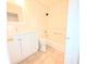 A clean, compact bathroom with a white vanity, toilet, and shower-tub combination with tiled walls at 1212 Utoy Springs Rd # 46, Atlanta, GA 30331