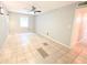 An empty, neutrally painted bedroom featuring tile flooring, a window, and a ceiling fan at 1212 Utoy Springs Rd # 46, Atlanta, GA 30331