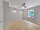 Bedroom with a window, ceiling fan, tiled floors and neutral paint at 1212 Utoy Springs Rd # 46, Atlanta, GA 30331