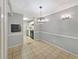 Dining area adjacent to kitchen with a modern light fixture at 1212 Utoy Springs Rd # 46, Atlanta, GA 30331