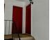A view of the red entry doors of this multifamily property, showing access to the units at 1212 Utoy Springs Rd # 46, Atlanta, GA 30331
