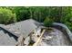 A well-maintained apartment building with balconies and ample parking, surrounded by mature trees at 1212 Utoy Springs Rd # 46, Atlanta, GA 30331