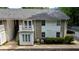 A multi-level apartment building featuring a charming white balcony, stairs, and a well-maintained exterior at 1212 Utoy Springs Rd # 46, Atlanta, GA 30331