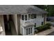 A multi-level apartment building featuring a charming white balcony, stairs, and a well-maintained exterior at 1212 Utoy Springs Rd # 46, Atlanta, GA 30331