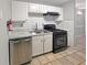 Modern kitchen with white cabinets, stainless steel appliances and tile backsplash at 1212 Utoy Springs Rd # 46, Atlanta, GA 30331