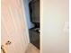 A stacked, black washer-dryer combination located inside a dedicated laundry area at 1212 Utoy Springs Rd # 46, Atlanta, GA 30331