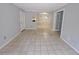 This living room features a tile floor, neutral-tone walls, and an entryway to a dining area, creating an inviting space at 1212 Utoy Springs Rd # 46, Atlanta, GA 30331
