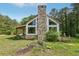 Charming home featuring stone accents, a large chimney, and big bright windows at 2003 Greeson Rd, Dacula, GA 30019