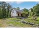 New home under construction with stone and siding, covered porch and stone chimney with a large yard at 2003 Greeson Rd, Dacula, GA 30019