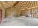 Room under construction featuring vaulted ceilings, big windows, a red door and utility sink at 2003 Greeson Rd, Dacula, GA 30019