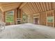 Spacious living room under construction featuring big windows, vaulted ceiling and fireplace at 2003 Greeson Rd, Dacula, GA 30019
