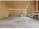 Unfinished living room featuring wood framework, fireplace, sink, with large windows for ample natural light at 2003 Greeson Rd, Dacula, GA 30019