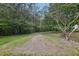 Spacious lot showcasing a mix of grass and gravel at 2003 Greeson Rd, Dacula, GA 30019