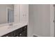 Bathroom featuring a dark vanity with light countertop and brushed nickel hardware at 2320 Ivy Birch Ln, Buford, GA 30519