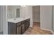 This bathroom features a double sink vanity and a walk-in closet at 2320 Ivy Birch Ln, Buford, GA 30519