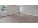 Spacious bedroom features neutral walls, carpet and two windows for natural light at 2320 Ivy Birch Ln, Buford, GA 30519