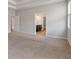Large bedroom features neutral walls, carpet, and a door to a bathroom at 2320 Ivy Birch Ln, Buford, GA 30519