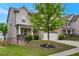 Charming two-story home featuring a stone facade, covered porch, and beautifully landscaped front yard at 2320 Ivy Birch Ln, Buford, GA 30519