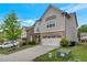 Attractive two-story home with a two-car garage and well-manicured lawn and landscaping at 2320 Ivy Birch Ln, Buford, GA 30519