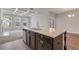 This large island features stainless appliances and a view into the living room at 2320 Ivy Birch Ln, Buford, GA 30519
