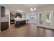 A spacious kitchen featuring dark wood cabinets and a large island at 2320 Ivy Birch Ln, Buford, GA 30519
