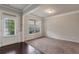 Bright living room with large window and plush carpeting at 2320 Ivy Birch Ln, Buford, GA 30519