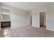 Bedroom featuring entryways to the bathroom and closet, carpeted floor, and natural light at 2320 Ivy Birch Ln, Buford, GA 30519
