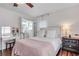 Bright bedroom featuring hardwood floors, natural light, modern fixtures, and vanity area at 2653 Elkhart Sw Cir, Marietta, GA 30064